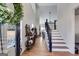 Bright foyer with high ceilings and hardwood flooring that leads to the staircase at 1721 Mcgarity Rd, Temple, GA 30179