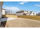 The spacious fenced backyard features a small concrete patio, offering privacy and room for outdoor activities at 3460 Sycamore Sw Dr, South Fulton, GA 30331