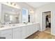 Large bathroom with double sink vanity and separate glass enclosed shower at 3460 Sycamore Sw Dr, South Fulton, GA 30331