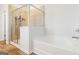 Modern bathroom features a glass shower enclosure and soaking tub at 3460 Sycamore Sw Dr, South Fulton, GA 30331