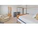 This cozy bedroom includes a chair and adjoins a modern bathroom at 3460 Sycamore Sw Dr, South Fulton, GA 30331
