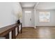 Inviting entryway with wood-look floors, a console table, and a view to the window, providing a bright and welcoming space at 3460 Sycamore Sw Dr, South Fulton, GA 30331