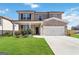 Beautiful two-story home with a well-kept lawn, stone accents, a welcoming front porch, and an attached two-car garage at 3460 Sycamore Sw Dr, South Fulton, GA 30331