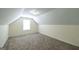 Finished attic space with carpeting, a window, and recessed lighting at 416 Clarion Dr, Carrollton, GA 30116