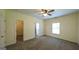 Spacious bedroom with neutral carpeting, ceiling fan, and a walk-in closet offers ample storage at 416 Clarion Dr, Carrollton, GA 30116