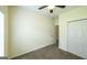 Bedroom featuring a ceiling fan, closet, and carpet at 416 Clarion Dr, Carrollton, GA 30116