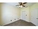 Cozy carpeted bedroom with a ceiling fan and closet at 416 Clarion Dr, Carrollton, GA 30116