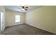 This primary bedroom offers ample space, neutral paint, carpet, and good natural light at 416 Clarion Dr, Carrollton, GA 30116
