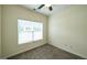 Bedroom featuring a ceiling fan, window, and carpet at 416 Clarion Dr, Carrollton, GA 30116