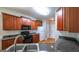 Modern kitchen features hardwood floors, stainless steel appliances, and ample counter space at 416 Clarion Dr, Carrollton, GA 30116