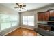 Bright kitchen with hardwood floors and large windows offer plenty of natural light at 416 Clarion Dr, Carrollton, GA 30116