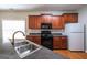 Well-equipped kitchen features a stainless steel sink, matching appliances, and ample counter space at 416 Clarion Dr, Carrollton, GA 30116