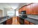 Bright and updated kitchen with stainless steel appliances and hardwood flooring at 416 Clarion Dr, Carrollton, GA 30116