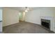 View of the cozy living room featuring a stone fireplace and neutral colored walls at 416 Clarion Dr, Carrollton, GA 30116