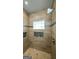 Tiled shower stall with a shower head and stylish design elements at 416 Clarion Dr, Carrollton, GA 30116