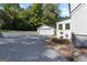 This backyard includes a detached garage, concrete driveway and manicured landscaping at 985 Columbia Dr, Decatur, GA 30030