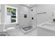 Modern bathroom boasts tiled shower with stylish accents, sleek fixtures, and natural light at 985 Columbia Dr, Decatur, GA 30030