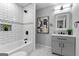 Stylish bathroom showcasing modern fixtures, subway tile, and a decorative niche, blending functionality with elegance at 985 Columbia Dr, Decatur, GA 30030