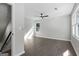 Well-lit bedroom featuring hardwood floors, a modern ceiling fan, and a bright window offering natural light at 985 Columbia Dr, Decatur, GA 30030