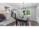 This dining room features a modern chandelier, dark wood floors, and staircase access at 985 Columbia Dr, Decatur, GA 30030