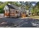 Beautiful white-brick home with inviting front porch, wood detailing, and manicured landscaping at 985 Columbia Dr, Decatur, GA 30030