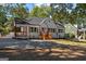 Charming white-brick home featuring wood shutters, a covered porch, and a well-maintained front yard at 985 Columbia Dr, Decatur, GA 30030