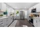 Contemporary kitchen with white cabinets, stainless steel appliances, and ample counter space at 985 Columbia Dr, Decatur, GA 30030