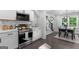 Modern kitchen design with stainless steel appliances, white cabinets, and sleek countertops at 985 Columbia Dr, Decatur, GA 30030