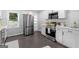 Modern kitchen featuring stainless steel appliances, white cabinetry, and sleek countertops at 985 Columbia Dr, Decatur, GA 30030