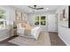 Inviting main bedroom with hardwood floors, large windows, and elegant neutral decor at 985 Columbia Dr, Decatur, GA 30030