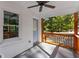 View of cozy porch with rustic wood railings and ceiling fan; a tranquil outdoor space at 985 Columbia Dr, Decatur, GA 30030