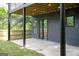 View of backyard featuring a concrete patio and a covered deck at 104 Meldon Se Ave, Atlanta, GA 30315