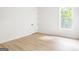 Bright bedroom with beautiful floors and large window overlooking the outdoors at 104 Meldon Se Ave, Atlanta, GA 30315