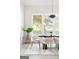 Bright dining area features modern table setting, complemented by natural light streaming through the expansive windows at 104 Meldon Se Ave, Atlanta, GA 30315
