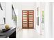 Clean and bright foyer with light wood floors, a striking front door, and modern decor at 104 Meldon Se Ave, Atlanta, GA 30315