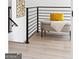 Bright foyer bench with soft yellow pillows and a stairway to the next level at 104 Meldon Se Ave, Atlanta, GA 30315