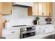 Bright kitchen features stainless steel oven, white countertops, and wooden cabinets at 104 Meldon Se Ave, Atlanta, GA 30315