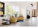 Bright living room featuring modern seating, large windows, and light wood floors at 104 Meldon Se Ave, Atlanta, GA 30315