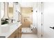 Stylish bathroom featuring double vanity sinks, a glass-enclosed shower with a bench, and modern fixtures at 104 Meldon Se Ave, Atlanta, GA 30315