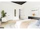 Bright main bedroom featuring a decorative ceiling, chandelier, and minimalist decor at 104 Meldon Se Ave, Atlanta, GA 30315