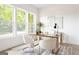 Bright office with natural light, wood desk, plush chairs, and stylish decor at 104 Meldon Se Ave, Atlanta, GA 30315