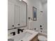 Modern bathroom featuring sleek fixtures, black faucet, and a beautifully tiled shower and a large mirror at 1006 Fendley St, Woodstock, GA 30188