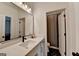 Well-lit bathroom with large mirror, white countertop, and sleek fixtures at 1006 Fendley St, Woodstock, GA 30188