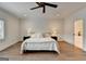 Bright bedroom featuring hardwood floors, recessed lighting, and a decorative ceiling fan at 1006 Fendley St, Woodstock, GA 30188