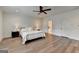 Large bedroom with hardwood floors, recessed lighting, a ceiling fan, and neutral paint at 1006 Fendley St, Woodstock, GA 30188