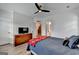 Comfortable bedroom with hardwood floors, ceiling fan, and neutral paint at 1006 Fendley St, Woodstock, GA 30188