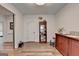 Inviting hallway with hardwood floors, neutral paint, and views into adjacent rooms at 1006 Fendley St, Woodstock, GA 30188