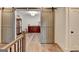 Hallway with decorative sliding barn doors leading to a beautifully decorated room with hardwood floors at 1006 Fendley St, Woodstock, GA 30188
