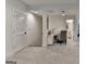 Bright hallway featuring a sewing desk, carpet, and view into an adjacent bathroom at 1006 Fendley St, Woodstock, GA 30188