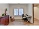 Bright home office with hardwood floors, a large window, and a contemporary desk at 1006 Fendley St, Woodstock, GA 30188
